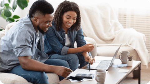 Young couple looking at a laptop
